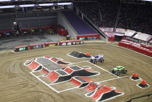 Photo of a Monster Jam course set up in an arena.