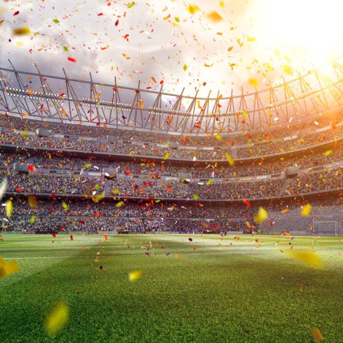 Photo of confetti falling in a soccer stadium.