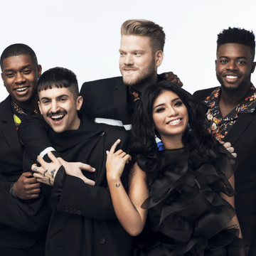 Members of Pentatonix dressed in black and posing for a picture