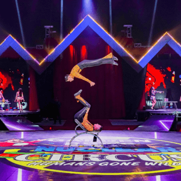 Photo of two acrobats performing in the Garden Bros Nuclear Circus.