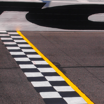 Photo of a racetrack finish line.