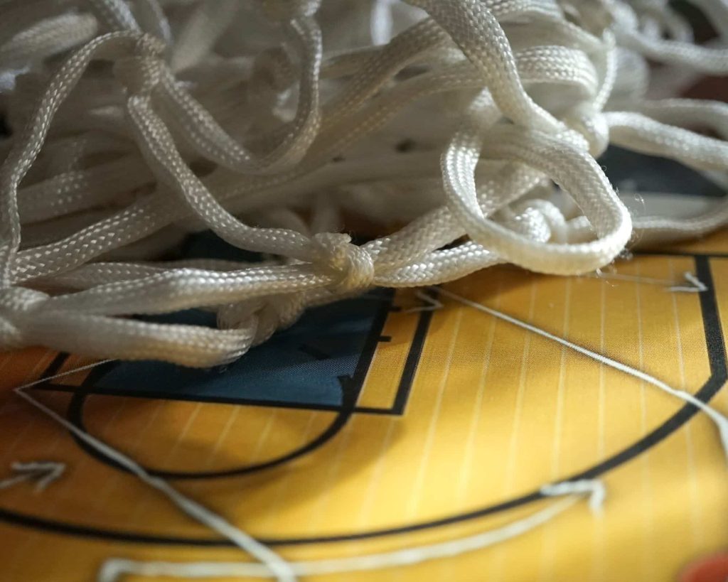 Photo of a basketball net on a clipboard.