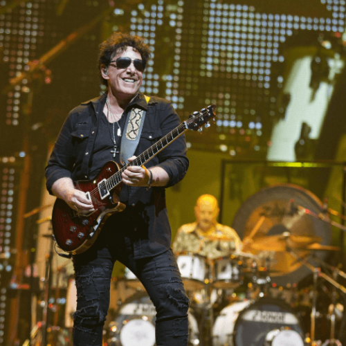 Image of Neal Schon of Journey performing on stage