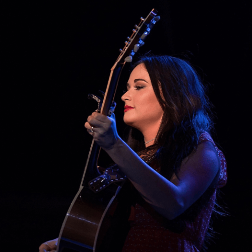 Image of Kacey Musgraves holding a guitar