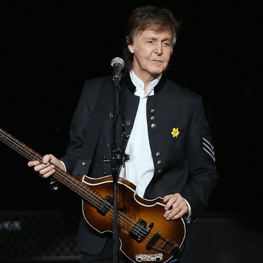 Image of Paul McCartney performing with a guitar